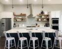 Custom Maple Kitchen cabinets. Shaker style doors and drawers. White Lacquer and Anchors away paint. Accented with solid cedar floating shelves.