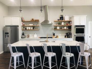 Maple cabinets with shaker doors. White lacquer and anchors away paint on the Island. 