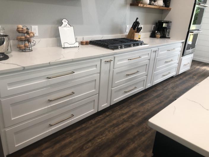 Maple cabinets with white lacquer finish.